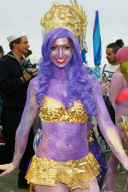 woman at mermaid parade on coney island - art women naked nudist imagens e fotografias de stock