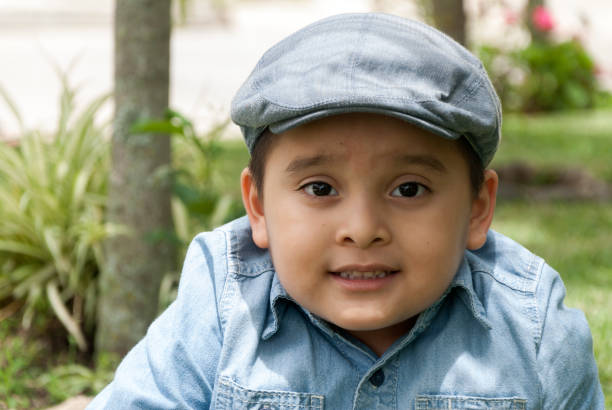 istock Boy in cap guatemalan latin expression, latin America. 962381784