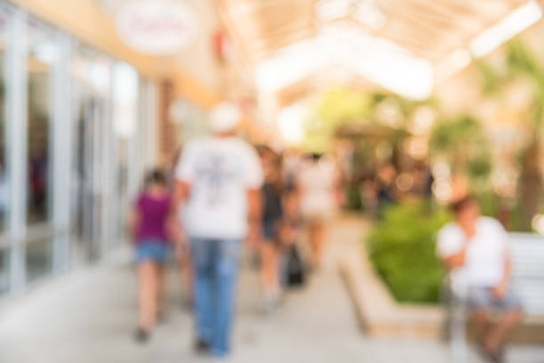 istock Blurred people shopping at outlet in America 962382130