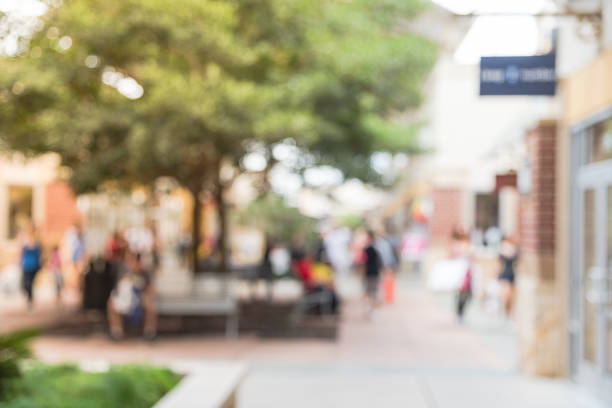 istock Blurred people shopping at outlet in America 962382972