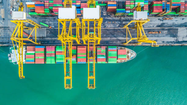 istock Aerial top view container cargo ship, Business import export logistic and transportation of International by container cargo ship in the open sea. 962383330
