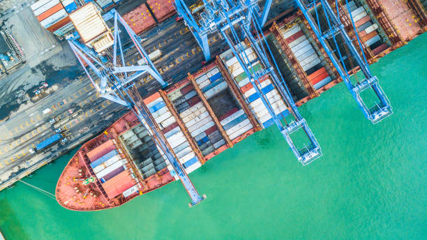 istock Aerial top view container cargo ship, Business import export logistic and transportation of International by container cargo ship in the open sea. 962383458