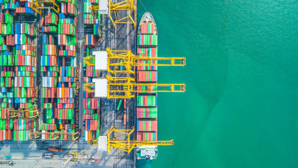 istock Aerial top view container cargo ship, Business import export logistic and transportation of International by container cargo ship in the open sea. 962383486