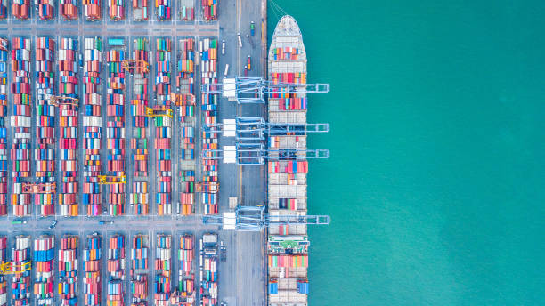 istock Aerial top view container cargo ship, Business import export logistic and transportation of International by containr cargo ship in the open sea. 962383548