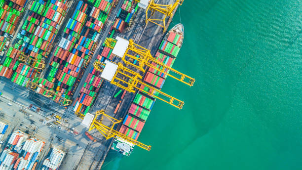 istock Aerial top view container cargo ship, Business import export logistic and transportation of International by container cargo ship in the open sea. 962385848