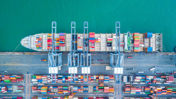 istock Aerial top view container cargo ship, Business import export logistic and transportation of International by containr cargo ship in the open sea. 962385894