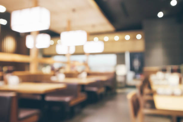 istock abstract blurred cafe restaurant with bokeh lights defocused background 962387384
