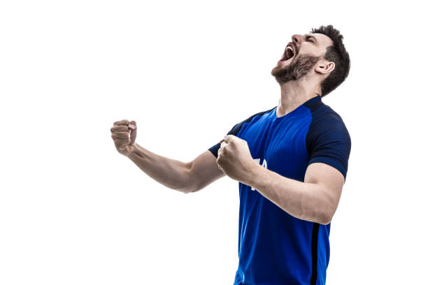 istock Male athlete / fan in blue uniform celebrating on white background 962400490