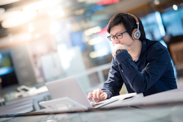 istock Young Asian business man feeling stressed while working with laptop computer 962402868