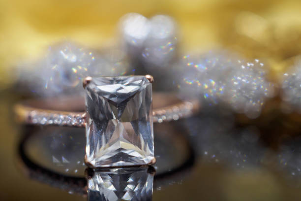 istock Luxury Jewelry diamond and pink topaz ring with reflection on black background 962403662