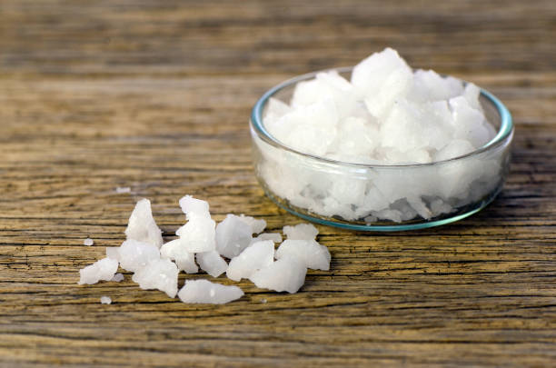 istock Natural sea salt on old wood table. 962404282