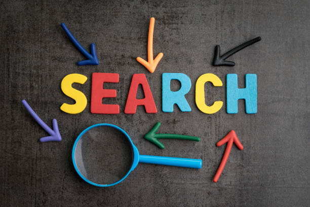 istock Search concept, best way finding website and content from the internet, result by SEO ranking, magnifying glass with arrows pointing to word SEARCH at the center of cement wall chalkboard 962404424