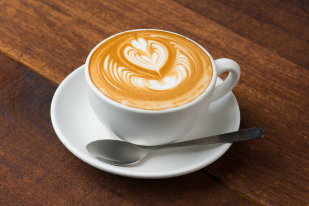 istock latte art with wood background 962407370