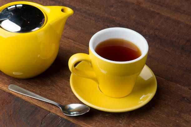 istock cup of tea teapot on wood table 962407396