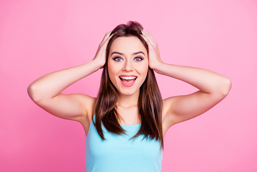 I don't believe you! Portrait of cheerful delightful adorable attractive gorgeous with beaming toothy surprised smile woman wearing light blue t-shirt singlet isolated on pink background