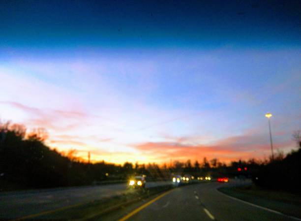 istock Evening Sunset on Road With Cars 962408084