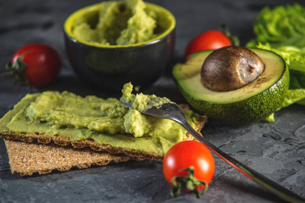 istock Mexican cold appetizer made of pureed avocado pulp with bread and vegetables. Concept healthy vegetarian Breakfast 962408510
