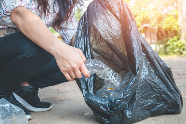 istock Women volunteer help garbage collection charity environment, concept cleaning. 962408760
