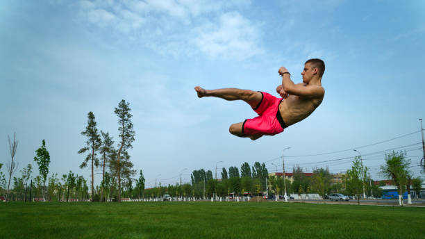 istock Tricking on lawn in park 962410968