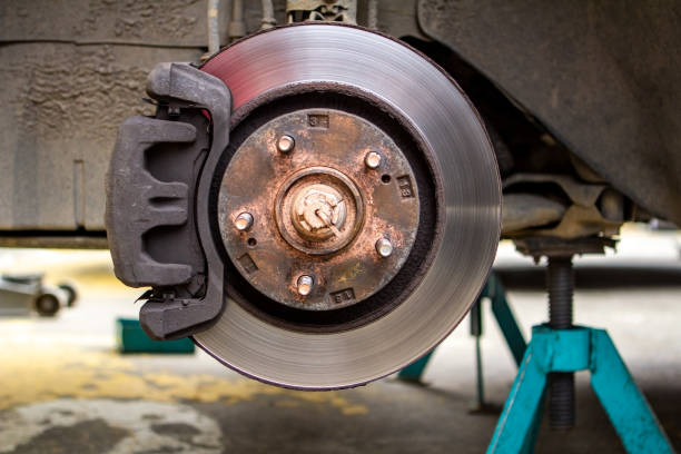 istock brake discs on the machine with the removed wheels on the jacks. wheel replacements 962417012