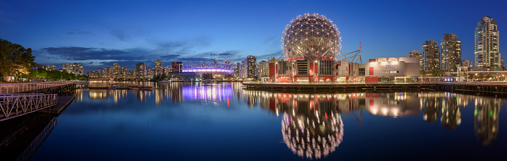 VANCOUVER, BRITISH COLUMBIA - MAY 3, 2018: An evening panorama of Science World and downtown Vancouver across False Creek.