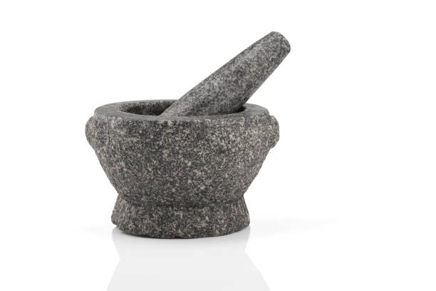 istock Stone mortar and pestle are cooking tool. 962426170