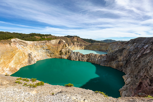 View of the two of the three tri-colored lakes on the peak of Ganung Kelimutu National Park in Flores, Indonesia.