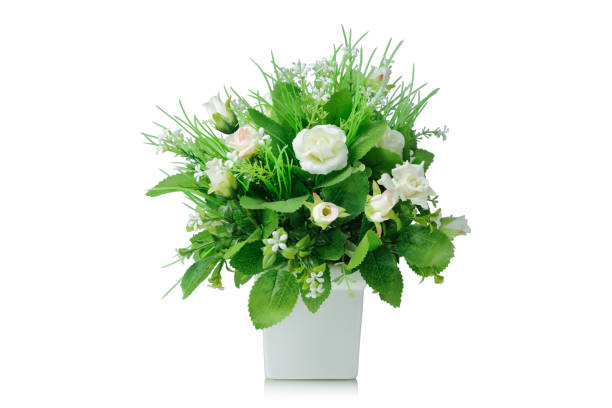 istock Artificial flowers bouquet in vase isolated on white background 962430136