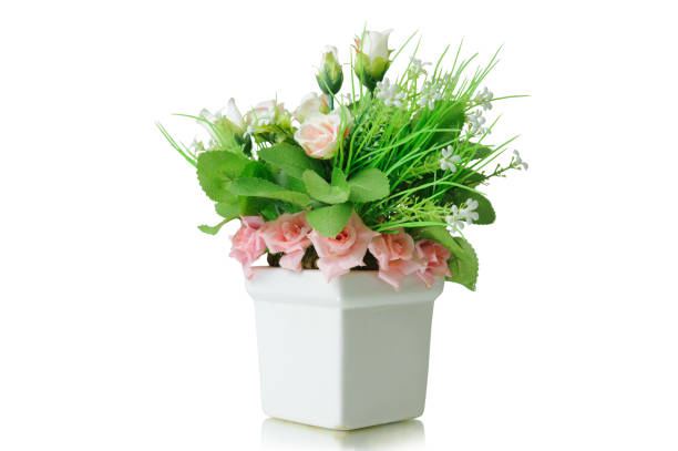 istock Artificial flowers bouquet in vase isolated on white background 962430696