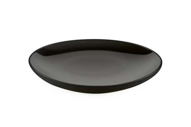 istock Empty black porcelain plate isolated on white background 962430920