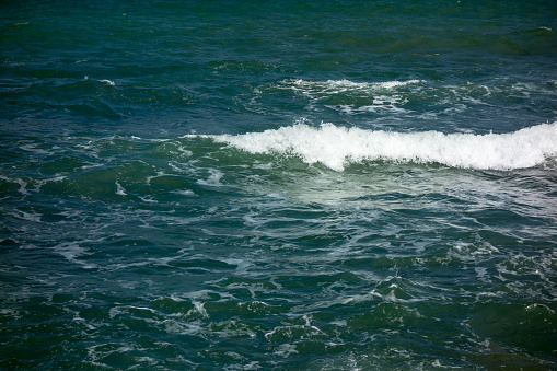 Crashing blue/green and white waves