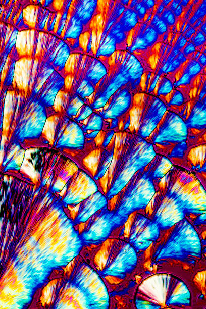 istock Abstract micrograph of ascorbic acid crystals in brilliant arrays. 962434672