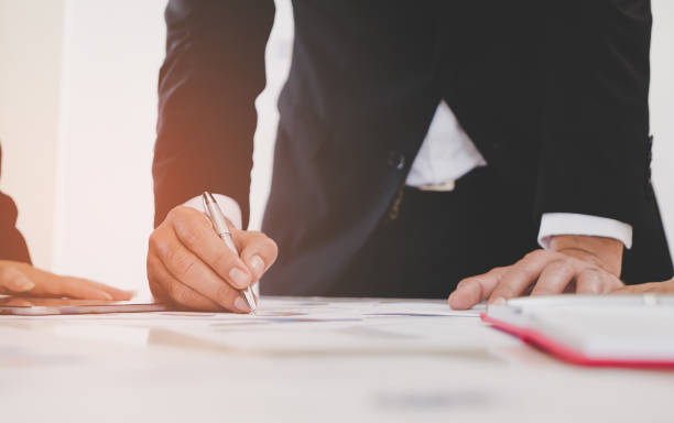 istock business man Hand writing on to a notebook 962434790