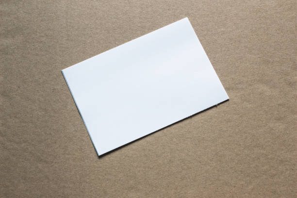 istock Blank portrait mock-up paper. brochure magazine isolated on grey, changeable background / white paper isolated on grey 962436088