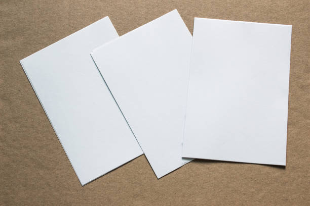istock Blank portrait mock-up paper. brochure magazine isolated on grey, changeable background / white paper isolated on grey 962436508