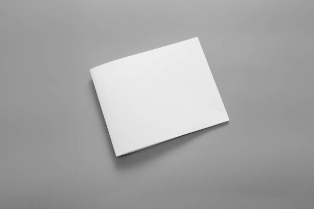 istock Blank portrait mock-up paper. brochure magazine isolated on grey, changeable background / white paper isolated on grey 962436706