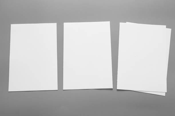 istock Blank portrait mock-up paper. brochure magazine isolated on grey, changeable background / white paper isolated on grey 962436880