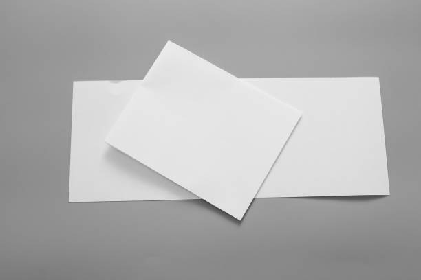 istock Blank portrait mock-up paper. brochure magazine isolated on grey, changeable background / white paper isolated on grey 962436962