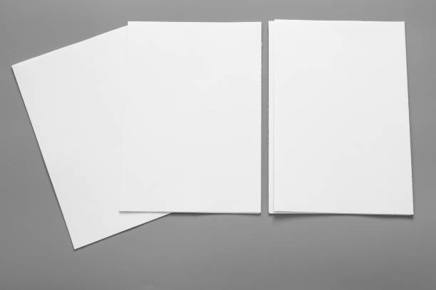 istock Blank portrait mock-up paper. brochure magazine isolated on grey, changeable background / white paper isolated on grey 962439518