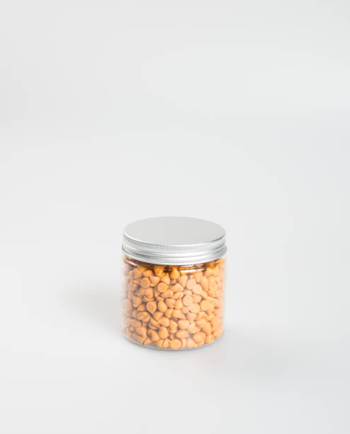 Chocolate chip morsels spread on a background