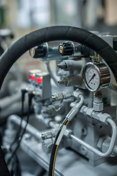 istock Mechanic automatic pump working at factory. Industrial interior and machinery 962441728