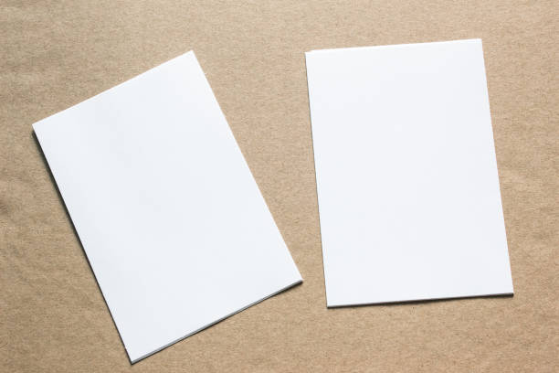 istock Blank portrait mock-up paper. brochure magazine isolated on grey, changeable background / white paper isolated on grey 962441864
