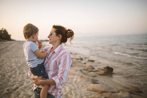 istock Mother and son at the beach 962443542