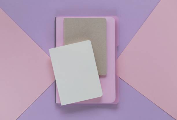 istock notebook on trend lilac pink graphic background. empty diaries on a geometric background in trendy pastel tones. flat lay in pastel colors. top view, copy space 962445690