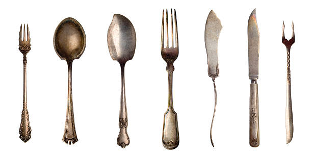 Vintage silver cutlery for dessert on old wooden background