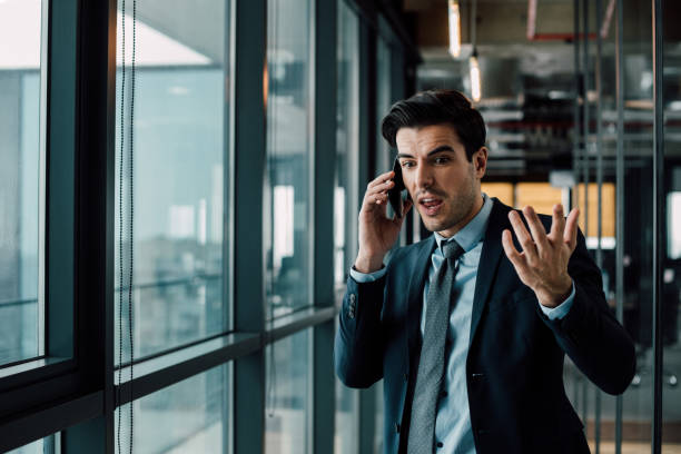 istock Amazed businessman annoyed with phone call 962449008