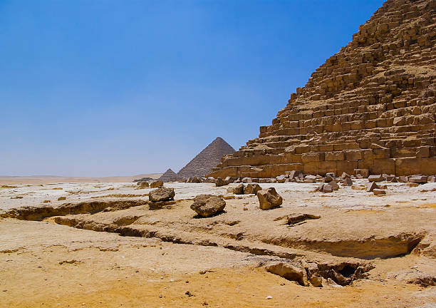 Desert and ruined pyramid stock photo