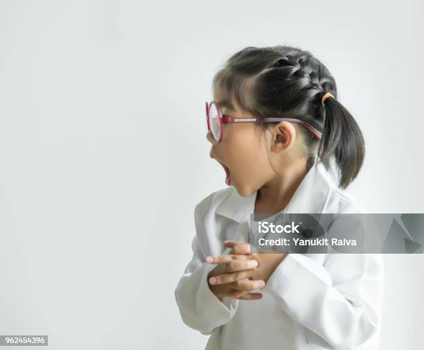 Asian Girl With Big Glass And Science Suite Action On White Screen Stock Photo - Download Image Now