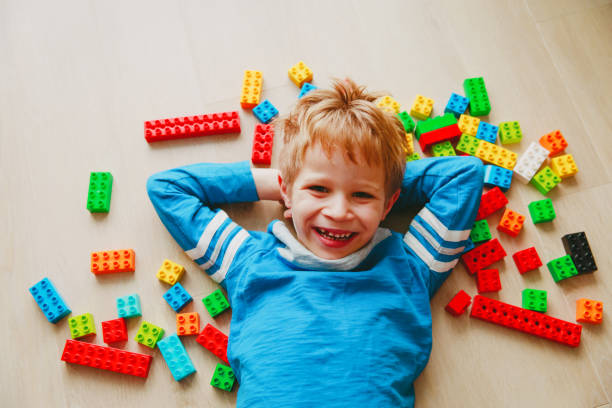 istock cute little boy love play with plastic blocks 962455118