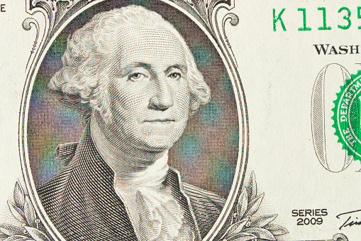 Portrait of President George Washington on 1 dollar bill. Close up.